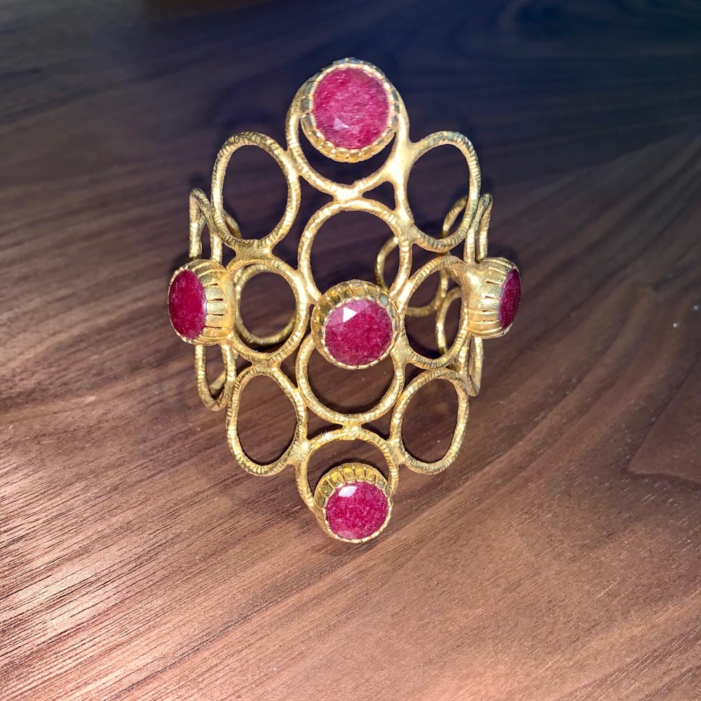 Studded gold cuff with beautiful magenta stones